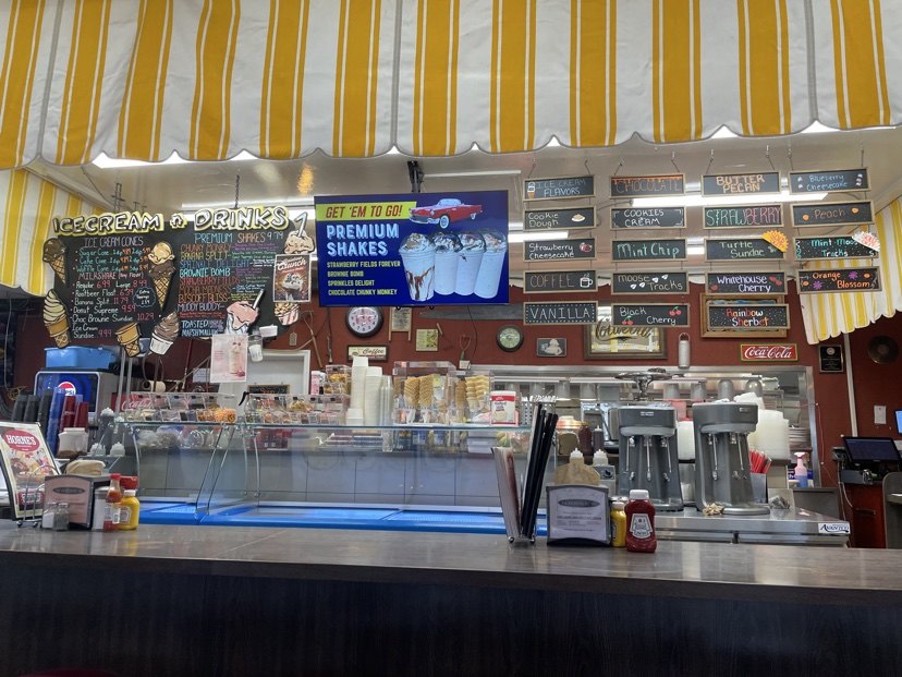 The ice cream counter, menu boards and Premium Shakes sign at Horne's